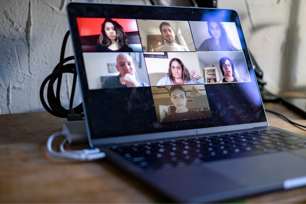 Laptop on a work-from-home desk used for a virtual team meeting during the COVID-19 pandemic.