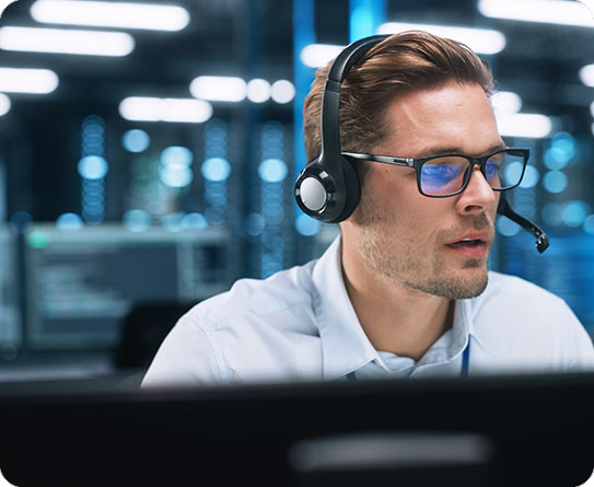 A customer service professional wearing a headset in a modern office, showcasing support in administrative roles.