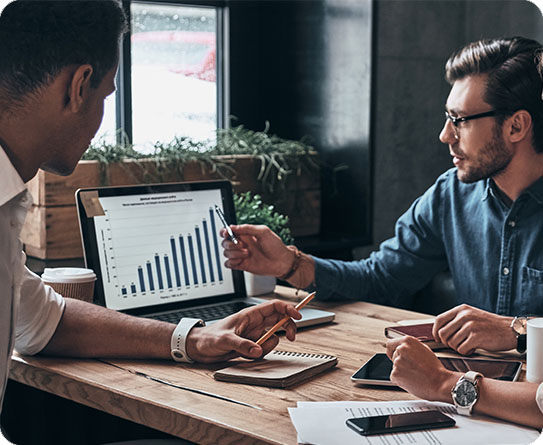 Professionals analysing business data in a collaborative workspace.