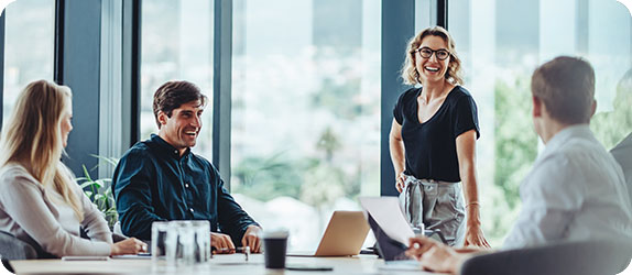 A group of professionals collaborating during a meeting in a bright office