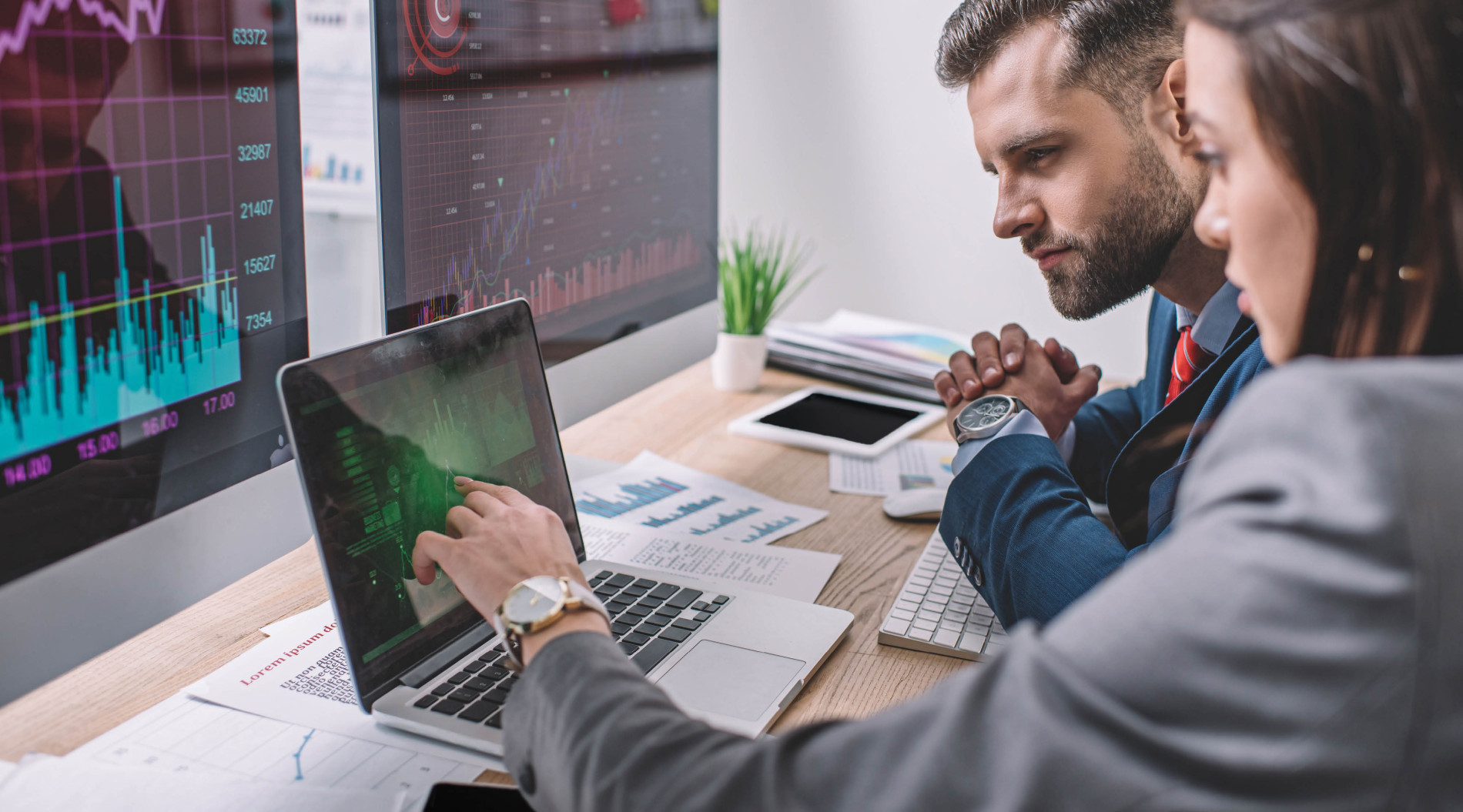 Two people analyzing data.