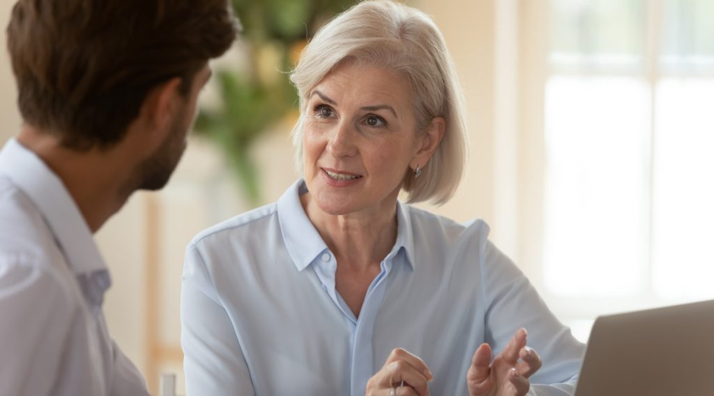 Older looking woman in an interview