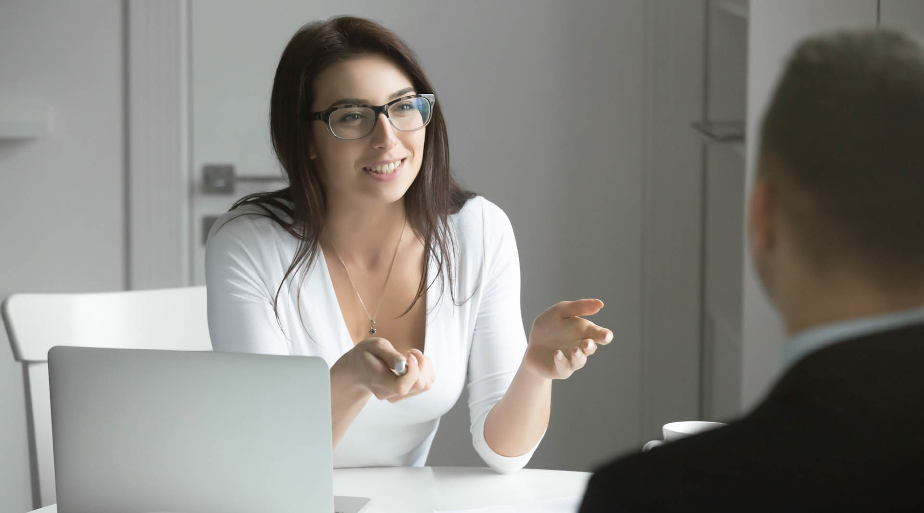 Businesswoman interviewing male candidate