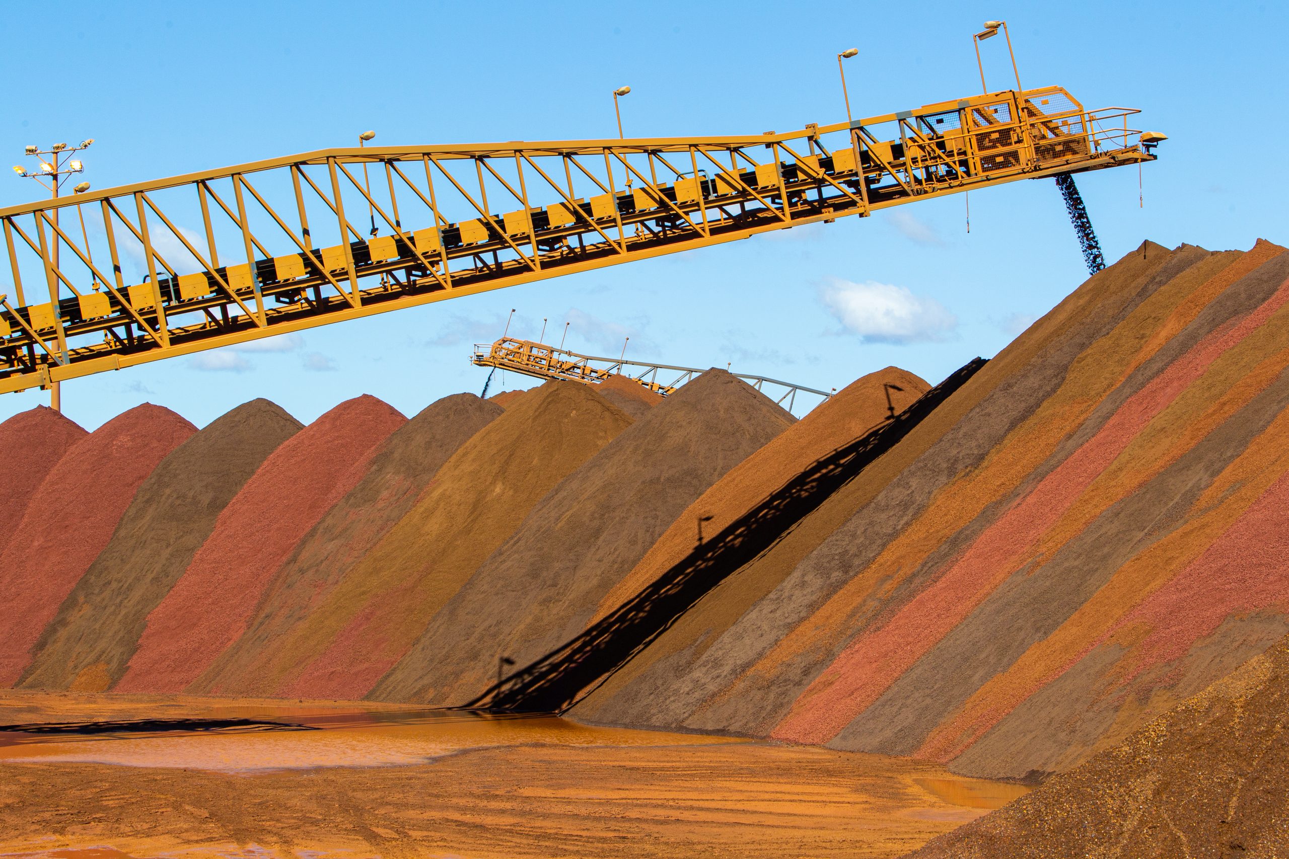 Stock,Piles,Of,Iron,Ore,At,Port.