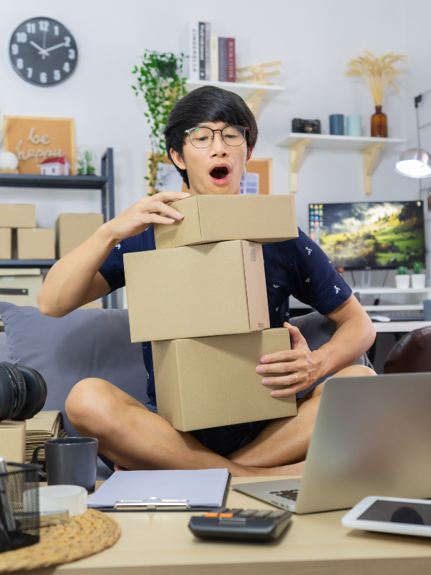 Man juggling with boxes