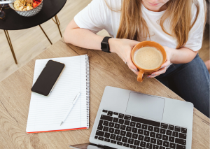 Lap top note pad and cup of coffee 