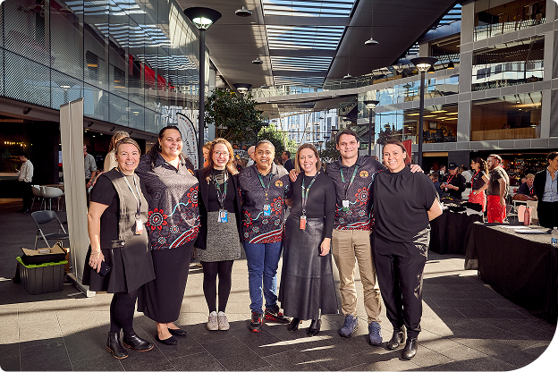 Our Daramu Network standing and smiling together 