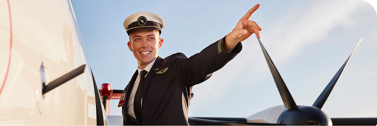 Pilot entering plane, pointing out to the horizon