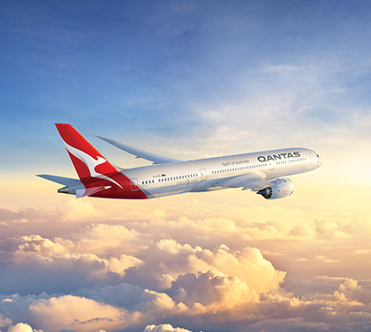 Qantas Dreamliner flying above the clouds