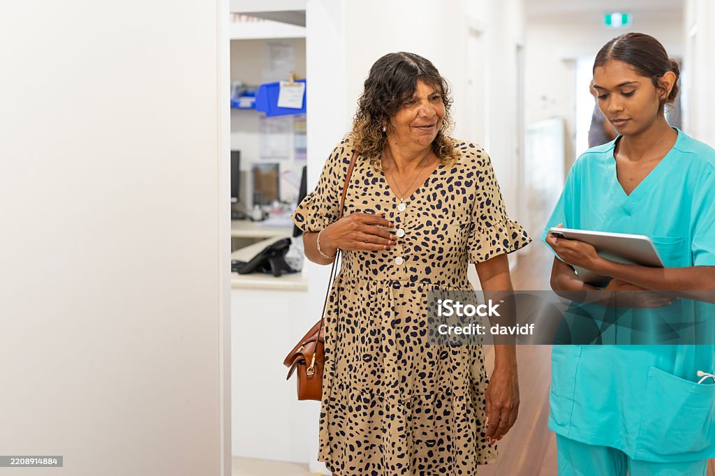 Australian Aboriginal Medical Staff Assisting Patients