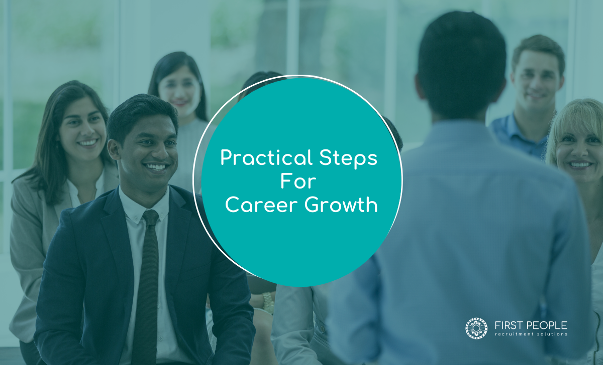 Diverse group of professionals listening to a speaker during a career growth seminar