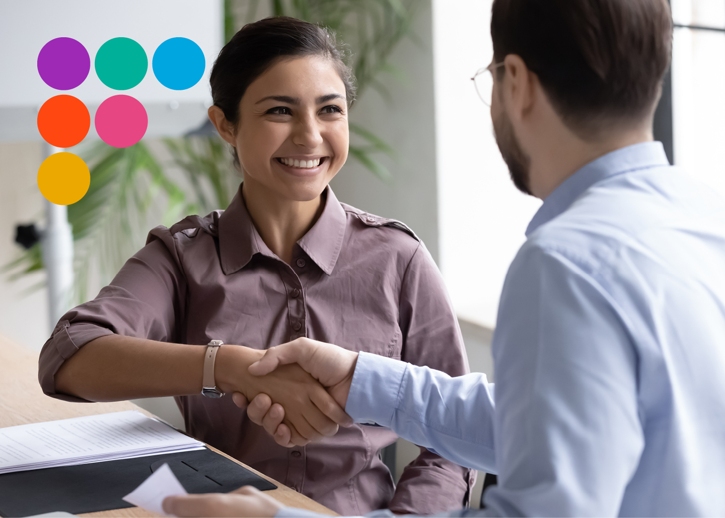 woman shaking hands with man