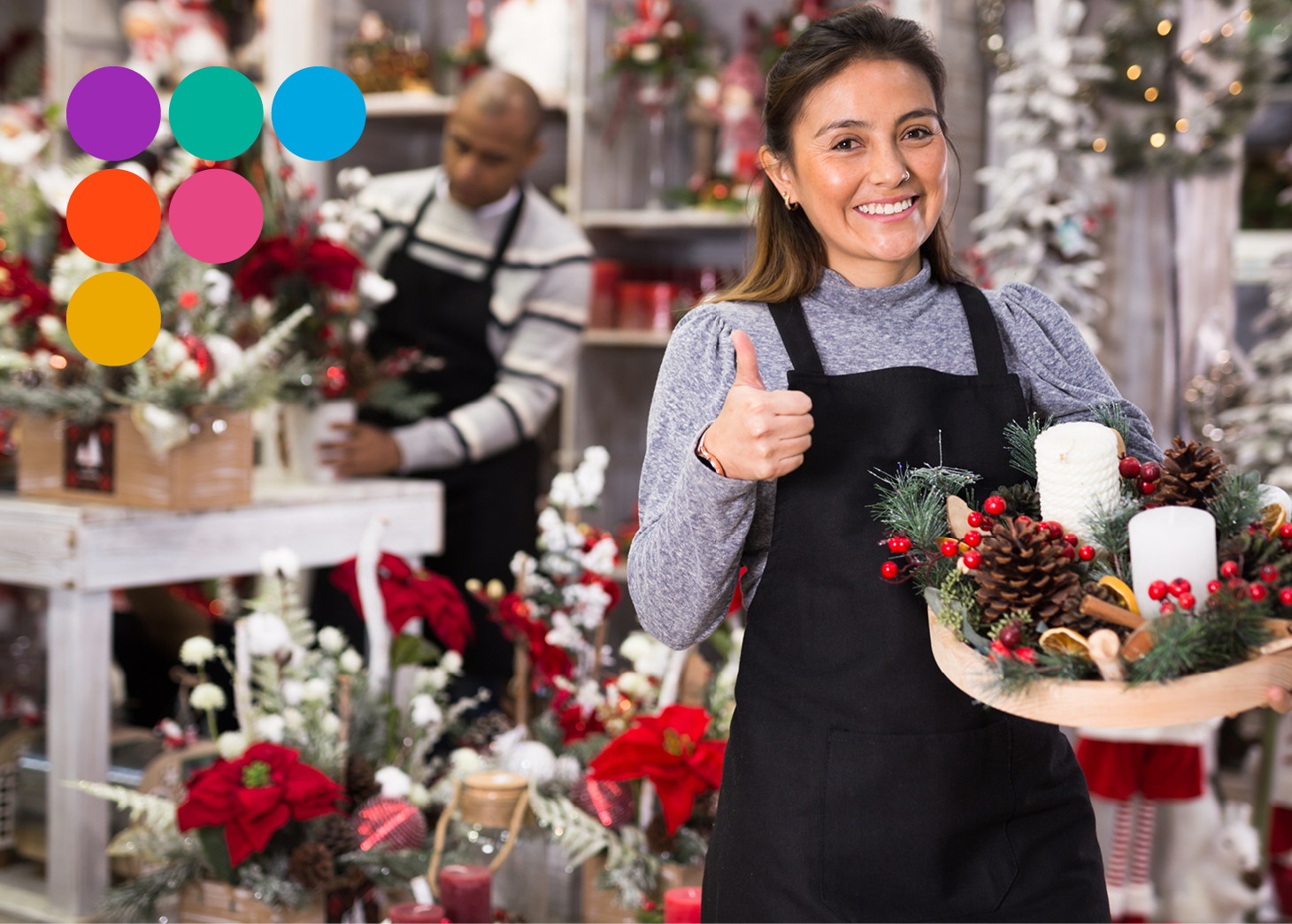 Lady in a decorated shop giving thumbs up