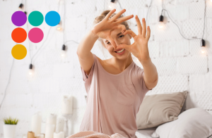 woman forming a heart with her hands