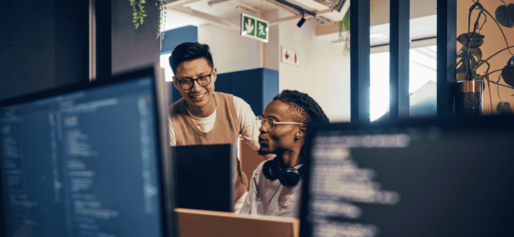 Software Engineers collaborating on coding and software development projects in an Australian technology company.