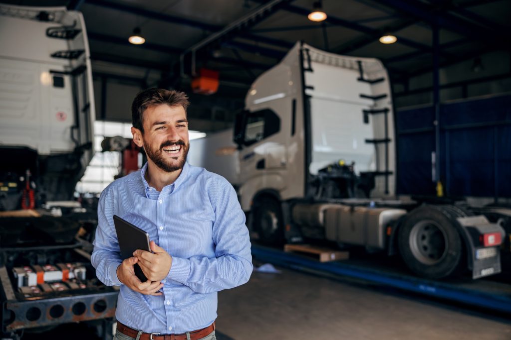 Supply Chain Manager in a logistics facility overseeing truck operations and supply chain efficiency in Australia.