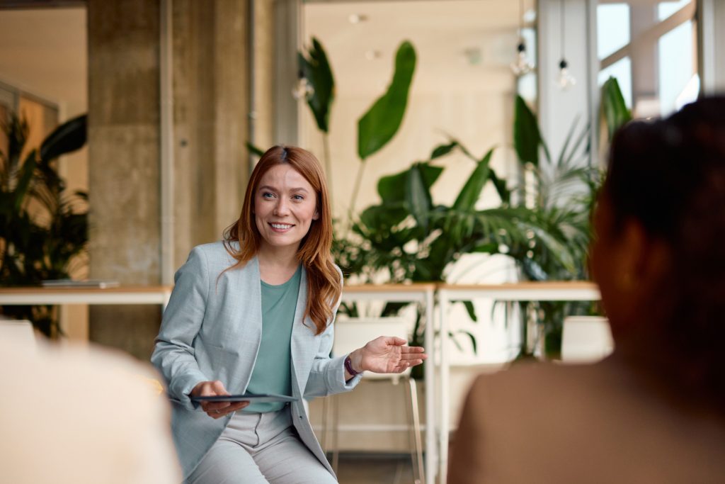Head of People and Culture guiding a discussion on team development and workplace culture in an Australian office environment.