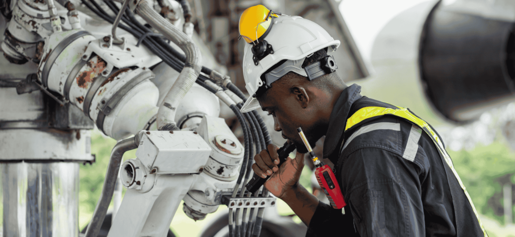 Mechanical Engineer inspecting and maintaining industrial equipment to ensure safe and efficient operations in an Australian facility.