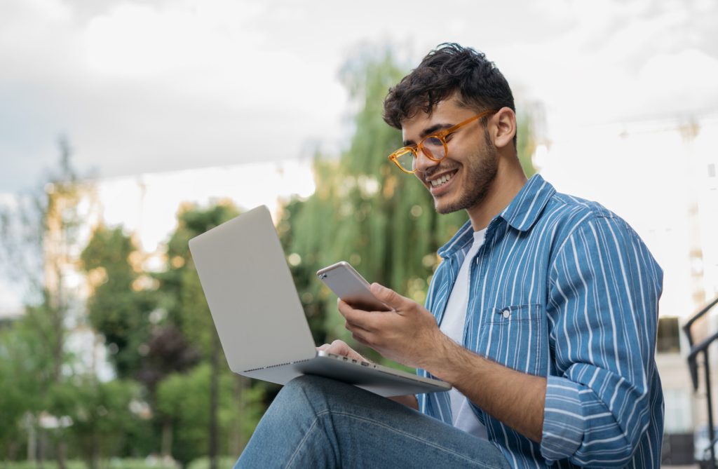 Person working on a laptop as part of an active job search