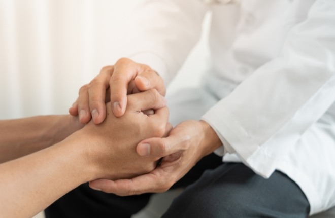 Supportive hands holding other hands