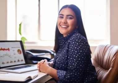 The Role of Data and Analytics in Volume Recruitment Optimisation - woman in longsleeve smiling