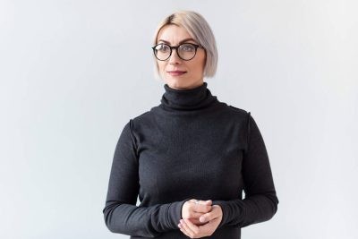 executive recruitment - woman with white hair wearing glasses