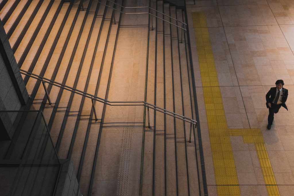 Man at the bottom of stairs