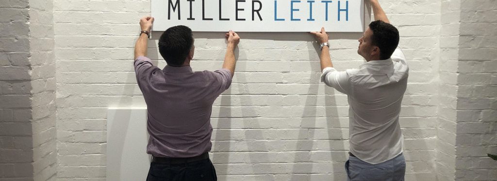founders putting up the Miller Leith signage