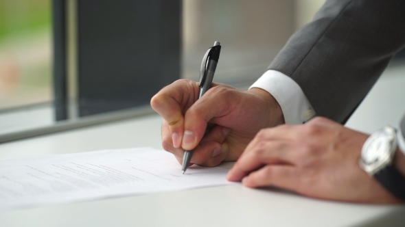 person signing a form