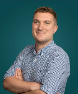 Dark headshot of our sales recruitment consultant within FMCG & retail based in Melbourne, Greg Camm who is based in Melbourne