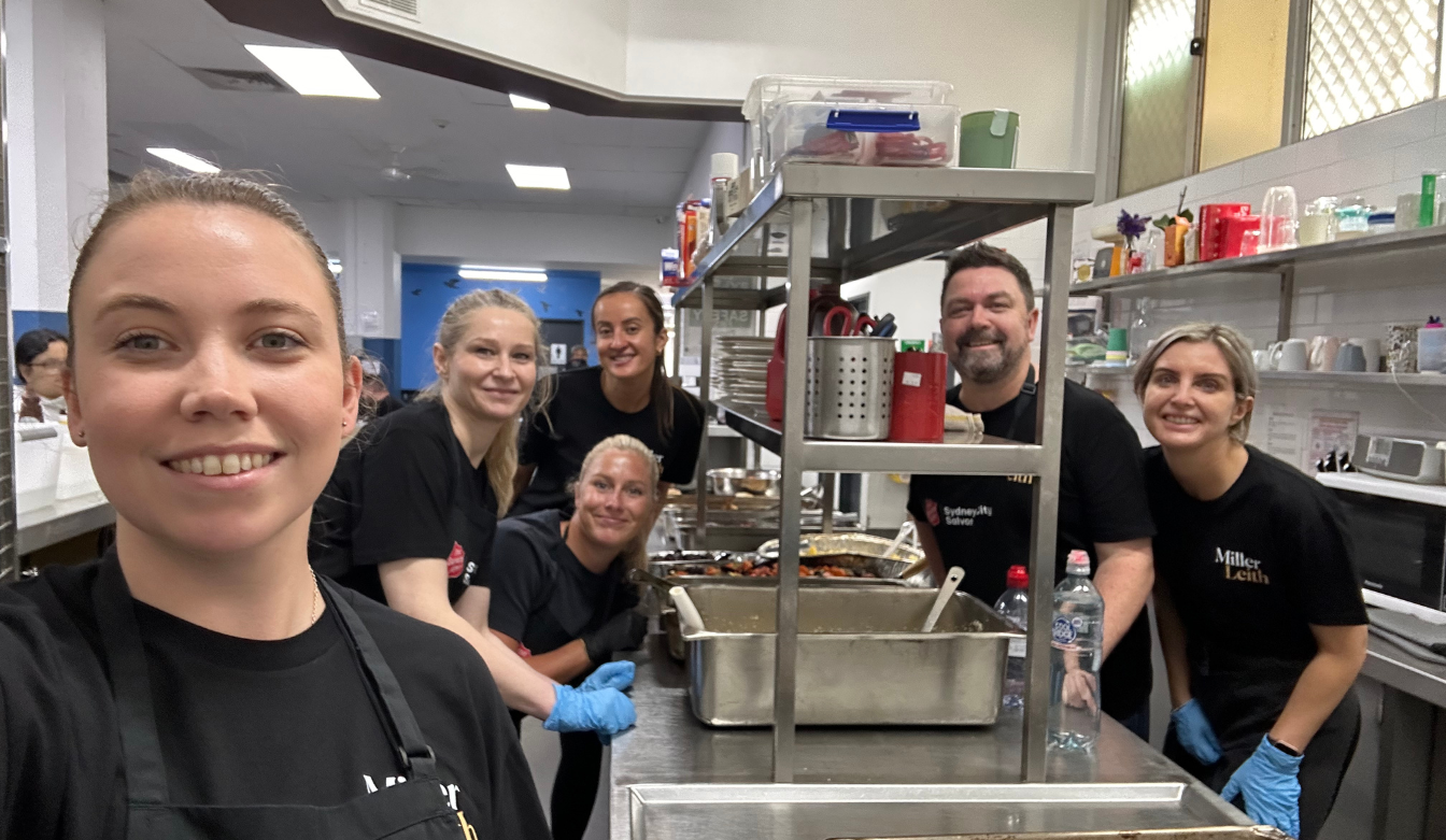 Our Sydney Team cooking a meal, volunteering for salvation army.