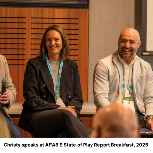 Christy speaking at a panel event