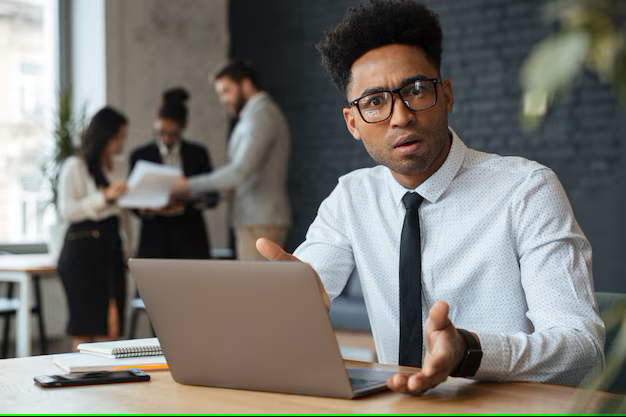 confused-young-african-businessman_171337-740