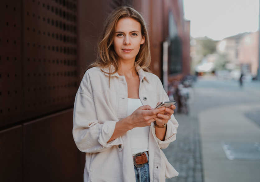 Person holding a phone - Talon Recruitment Solutions