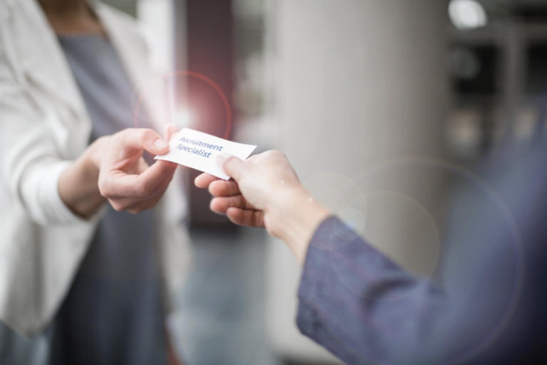 Handing a ticket to someone - Talon Recruitment Solutions