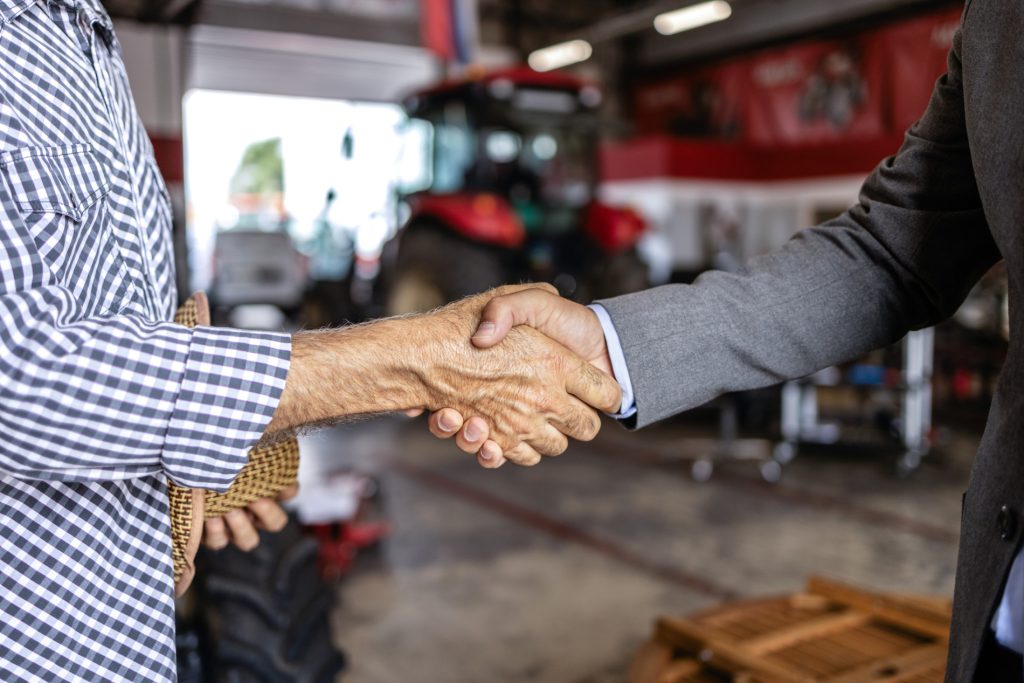 Close-up of two hands shaking, symbolising agreement and partnership in trade and engineering recruitment.