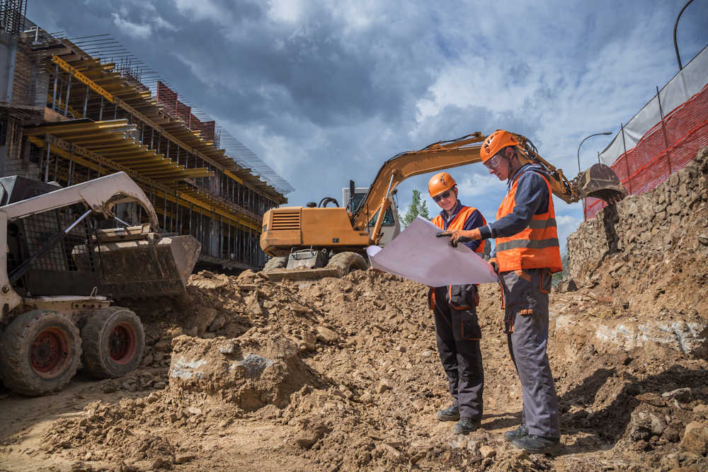 TechTrade construction engineers reviewing site progress